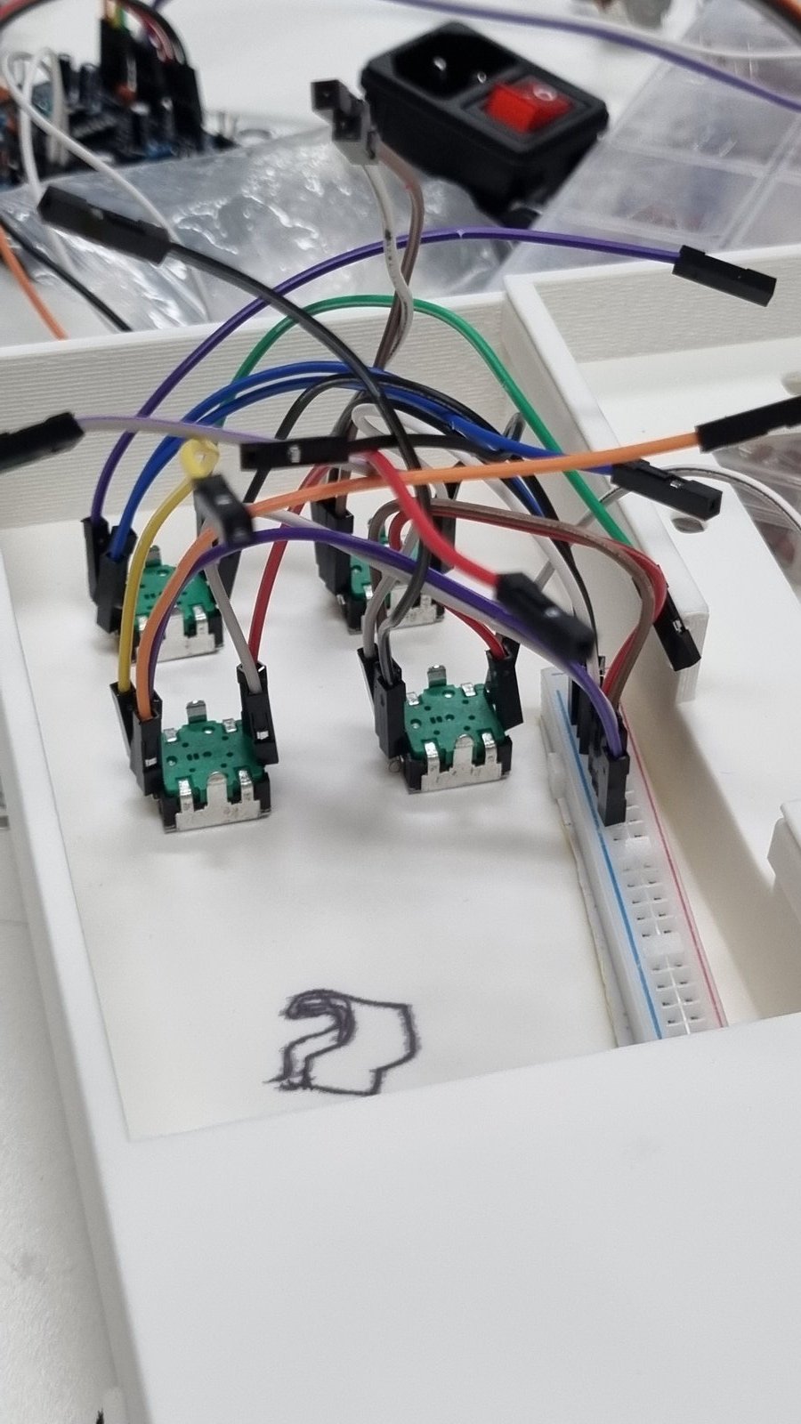 Encoders mounted with GND wires connected to the breadboard rail
