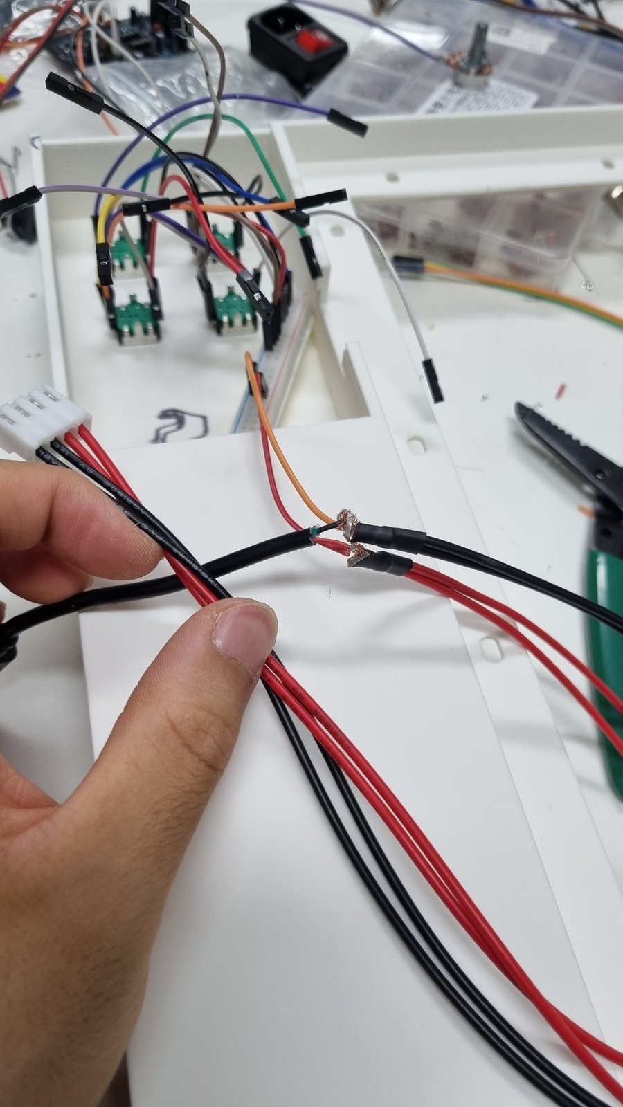 Stripped USB and LED panel power wires being twisted onto jumpers